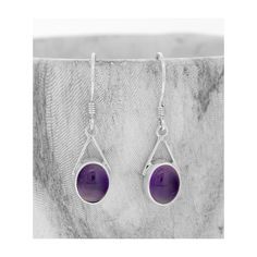 Amethyst Earrings : A classic pair of oval shaped Amethyst Cabochon stone earrings with an arch of sterling silver. . 💖 SIZE The stones measure 8mm x 10mm, 29mm including hook and have been hand set into a sterling silver setting with a shepherd's hook with a safety catch. 💖 PRODUCT INFORMATION Purple amethyst has represented power through time. Carved, polished amethyst stones and gems were used by the Egyptians as early as 4000 BC.  Amethyst is a meditative and calming stone which makes this the perfect gift for someone who has any exams or tests in the future. Amethyst is the birthstone for February and the Zodiac stone for Aries.  Amethyst is also the 6th Anniversary Stone. Amethyst is a variety of quartz with a degree of hardness that makes it durable and perfect for Jewellery makin Round Purple Earrings With Natural Stones, Purple Natural Stones Round Earrings, Purple Earrings With Natural Stones, Round Amethyst Earrings With Natural Stones, Oval Amethyst Earrings For Gift, Zodiac Stones, Amethyst Stones, Shepherds Hook, Calming Stones