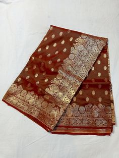 Hand Woven Banarsi Silk Heavy Zari Pallu Bridal Silk Saree With Blouse OFFER- EXTRA 20$ OFF ON PURCHASE OF TWO PRODUCTS. A beautiful, delightful, and absolutely luxurious Banarasi dream! For Instance, The Saree Has where each thread of the Butiy Is knitted by hands. Additionally, It comes In the purest banarasi silk with the pure banarasi silk blouse piece. above all, with vows to sustainable fashion, this silk handloom product from Banaras is a masterpiece involving of brilliance & sheer endeavor of our creative artisans. Tassels vary from the image. Blouse worn by model is for styling purpose only. FABRIC - Banarasi Silk BLOUSE PIECE - Yes TECHNIQUE - This Splendid Masterpiece is made of the finest Fekwa technique of Banaras. WEAVE - Handwoven SILK - 100% Authentic Banarasi Satin Silk Pl Brocade Pre-draped Saree For Diwali Puja, Meenakari Raw Silk Pre-draped Saree For Wedding, Brocade Traditional Wear For Puja During Diwali, Traditional Pre-draped Saree For Wedding And Diwali, Ceremonial Semi-stitched Saree With Self Design, Ceremonial Art Silk Saree With Self Design, Brocade Saree For Puja And Eid, Gold Ceremonial Saree With Self Design, Ceremonial Blouse Piece In Gold With Self Design