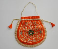 Embroidery Art Work on Money bags and clutches. Handmade Beautiful Designed Small bags for Party and wedding  the size of the item is 8X8 Inches. material  cotton silk Traditional Handmade Potli Bag For Festivals, Traditional Handmade Pouch For Diwali, Traditional Handmade Festive Pouch, Traditional Handmade Gold Pouch, Festive Traditional Handmade Pouch, Traditional Handmade Diwali Pouch, Clutch Potli Bag With Dori Work For Gift, Dori Work Clutch Potli Bag As Gift, Dori Work Potli Clutch Bag As Gift