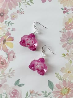 Elevate your style with these Shrink Plastic Pink Purple Orchid Flower with Aurora Crystal Beads Dangled Drop Earrings, a handmade masterpiece that combines the exotic allure of orchid blooms with the captivating sparkle of crystal beads. These earrings are a true celebration of creativity and craftsmanship. Each earring showcases a meticulously designed pink- purple orchid flower, intricately crafted from shrink plastic to capture the intricate details and delicate beauty of these exquisite blo Plastic Shrink Earrings, Shrink Plastic Christmas Ornaments, Shrink Plastic Art, Shrink Plastic Jewelry, Orchid Jewelry, Orchid Earrings, Pretty Jewelry Necklaces, Plastic Earrings, Pink Orchids