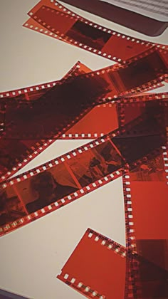 several film strips laid out on top of a table