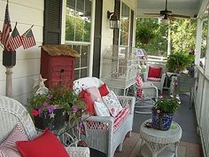 the porch is decorated with red, white and blue furniture for patriotic decorating purposes