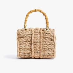 Timeless and posh, Pamela Munson’s straw accessories are beloved by island hoppers and city dwellers alike. Her bags reinterpret straw as a natural, sustainable material that can be worn any season, anywhere. Finally, a gold minaudière that goes with everything. This handwoven raffia handbag is expertly crafted and beautifully finished with brushed gold mini hardware, bamboo and rattan. Every detail is considered with special attention to function and versatility. Named after Pamela’s grandmothe Chic Jute Straw Bag With Round Handle, Natural Top Handle Straw Bag For Day Out, Chic Jute Shoulder Bag With Bamboo Handle, Natural Straw Bag With Detachable Handle For Travel, Natural Straw Bag With Detachable Handle For Summer, Chic Jute Crochet Bag With Bamboo Handle, Chic Natural Fiber Shoulder Bag With Bamboo Handle, Chic Natural Straw Bag With Round Handle, Chic Crochet Jute Bag With Bamboo Handle