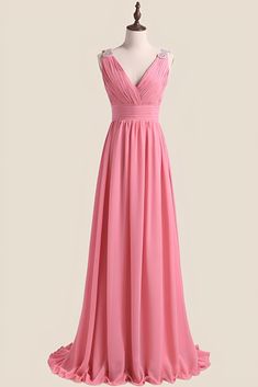 a pink bridesmaid dress on a mannequin