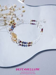 Inspired by the ancient Greek myth of the Lethe River, the "Wangchuan" bracelet captures the essence of forgetfulness and renewal. Just as the river's waters were believed to wash away the memories of the past, this bracelet, adorned with faceted white crystal beads, symbolizes a fresh start and clarity of mind. Each bead is meticulously faceted to enhance its natural brilliance, complemented by delicate accents that add a touch of elegance. This piece is a harmonious blend of mythology and mode Spiritual Silver Beaded Bracelets For Blessing, Spiritual Faceted Crystal Bangle Bracelet, Silver Healing Bracelet With 108 Beads, Silver Bracelet With 108 Beads For Healing, Lethe River, White Crystal Bracelet, Clarity Of Mind, Bracelet Inspired, Greek Myth