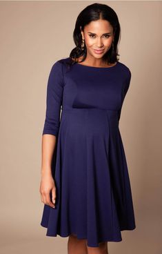 Cut to flatter throughout your pregnancy and after baby arrives too, the gently tailored shape of our Sienna Maternity Dress drapes beautifully over your curves with a soft panelled Ponte Roma skirt and neat princess seams to the bust. A classy and chic look that’ll never go out of style, this smart maternity dress in stylish navy blue is the perfect desk to dinner dress for your maternity wardrobe. Chic Maternity Dress Nursing Friendly, Fitted Long Sleeve Nursing-friendly Dress, Chic Nursing Friendly Maternity Dress, Fitted Long Sleeve Nursing Friendly Dress, Fitted Solid Color Maternity Dress, Elegant Long Sleeve Bump Friendly Dress, Maternity Empire Waist Dresses Nursing Friendly, Maternity Nursing-friendly Empire Waist Dress, Empire Waist Maternity Dress, Nursing Friendly