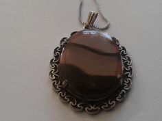 "These came in together, but adjustable chain is probably very recent and the pendant is likely 60s or 70s. Glass agates are frequently used in \"Scottish Pebble\" jewelry, much of it made in Birmingham, but this is completely unmarked and not overtly Celtic. \"Agate\" is a light brownish gray streaked with black. Good vintage condition. Chain adjusts from roughly 16\" to 18\". B11" Retro Brown Necklace For Gift, Retro Brown Jewelry For Gift, Brown Vintage Agate Necklace, Vintage Brown Agate Necklace, Retro Oval Necklace For Gift, Vintage Brown Jewelry With Adjustable Chain, Vintage Brown Nickel-free Necklace, Gray Streaks, Pebble Jewelry