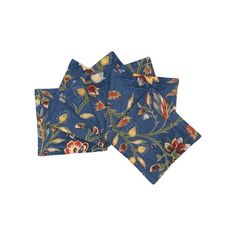 four blue floral napkins on a white background