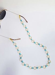 sunglass chain, Sunglass Holder, evil eye glasses chain, eyeglass chain, sunglass strap, sunglass strap, beaded strap, sunglass cord, boho Handmade eyeglass holder.  The strap is 28 inches long, if you pretend another size please let me know :)  Handmade with love :) Blue Adjustable Chain Glasses Chains For Summer, Sunglass Strap, Beaded Strap, Glasses Strap, Glasses Chains, Sunglasses Strap, Boho Handmade, Sunglass Chain, Sunglass Holder