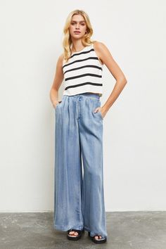 Model is wearing Denim Wide Leg Pants with a white black striped top and black sandals Versatile Straight-leg Bottoms For Elevated Casual Occasions, Trendy Dark Wash Wide Leg Pants, Relaxed Fit Dark Wash Wide Leg Pants, Light Wash Wide Leg Flare Jeans For Work, Dark Wash Relaxed Fit Wide Leg Pants, Summer Denim Wide Leg Pants With Relaxed Fit, Dark Wash Wide Leg Pants For Work, Wide-leg Denim Bottoms, Versatile Summer Flare Jeans With Relaxed Fit