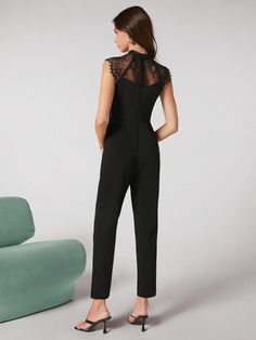 Step up your fashion game with our Zip Back Contrast Lace Sleeveless Jumpsuit from Comfy Jumpsuits. This elegant jumpsuit features a classic plain pattern with a unique contrast lace detail on the sleeves. The zipper back adds a modern touch, while the stand collar and sleeveless design create a sophisticated look. The high waist and skinny fit flatter your figure, and the long length adds a touch of glamour to any occasion. Made from fabric with slight stretch, this jumpsuit is comfortable and Fitted Sleeveless Jumpsuits And Rompers With Lace Trim, Fitted Sleeveless Jumpsuit With Lace Trim, Elegant Sleeveless Jumpsuits And Rompers With Lace Trim, Sleeveless Lace Trim Jumpsuit, Elegant Sleeveless Lace Trim Jumpsuits And Rompers, Elegant Sleeveless Lace Trim Jumpsuits, Chic Party Jumpsuits And Rompers With Lace Trim, Chic Lace Trim Jumpsuits And Rompers For Party, Elegant Jumpsuit