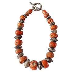 A wonderful example of a Tibetan Coral Bead mala / neckpiece with a stunning mix of orange & red colours that have aged beautifully over the decades. Tibetans believe that coral holds great power for the wearer both spiritually as well as physically. This necklace also features silver painted wooden beads. Dimensions; Length 40cm fully laid out (20cm when worn) x Width 4cm x Depth 2cm Weight: 195 grams. Amber Bead Necklace, Art Premier, Silver Paint, Wire Necklace, Coral Necklace, Amber Beads, Bone Beads, Great Power, Arte Popular