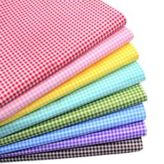 four different colored fabrics stacked on top of each other