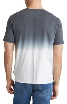 Bisected in bold dip-dye, this T-shirt made with soft, breathable cotton sports a relaxed vibe and a slim seam running up and down the back. Crewneck Short sleeves 60% cotton, 40% polyester Machine wash, dry flat Imported Casual Ombre Cotton Tops, Gradient Crew Neck Cotton Tops, Sporty Washed Cotton Tops, Gradient Cotton Crew Neck T-shirt, Sporty Acid Wash Crew Neck Top, Sporty Acid Wash Cotton Top, Acid Wash Cotton Sporty T-shirt, Sporty Acid Wash Cotton T-shirt, Sporty Relaxed Fit Tie Dye Tops