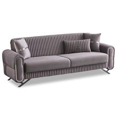 a gray couch with two pillows on it