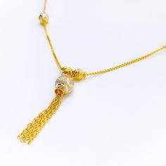 This impressive 22k gold necklace showcases a sleek design with a sophisticated blend of yellow and white gold finishes. Weighing 9.2 grams, it offers a luxurious yet comfortable feel. The combination of yellow and white gold enhances its modern and elegant appeal. With a necklace length of 18 inches and a drop length of 1.5 inches, this piece adds a touch of refined style to any outfit. The secure lobster lock ensures confident and comfortable wear. Elevate your jewelry collection with this exq Gold Bridal Necklace With Pendant And Elegant Design, Yellow Gold Pendant Necklace With Elegant Design, Elegant Round Pendant Necklace In Yellow Gold, Yellow 22k Gold Round Necklace, Gold Necklaces With Elegant Pendant Design, Yellow Gold Plated Chain Necklace With Round Pendant, Elegant Gold-plated Gold Necklace, Gold Clavicle Chain Bridal Pendant Necklace, Elegant Yellow Gold Plated Necklaces