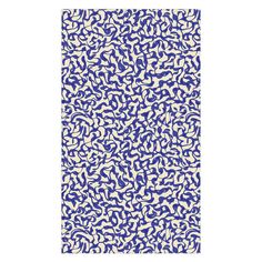 a blue and white rug with an abstract design on the bottom, in front of a white background