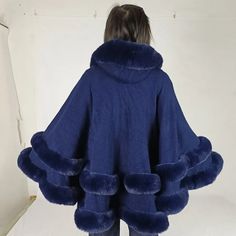 46212206854377 Blue Hooded Winter Cape, Elegant Hooded Faux Fur Outerwear, Winter Faux Fur Poncho With Trim, Winter Poncho With Faux Fur Trim, Luxury Winter Poncho, Winter Cape Outerwear With Faux Fur Trim, Winter Cape-shaped Faux Fur Coat, Faux Fur Winter Cape Coat, Cape Outerwear With Faux Fur Trim For Cold Weather