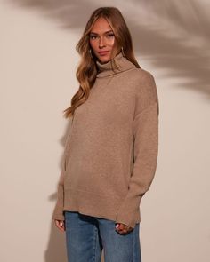 Warm, stylish, and oh-so-soft the Stay Close Cashmere Blend Turtleneck Sweater is sure to wrap you in effortless luxury. Crafted from ultra-soft knit fabric, this cozy essential is perfect for those chilly days when you want to look polished without sacrificing comfort. The foldover turtleneck styling adds a touch of classic sophistication, while the ribbed neckline, cuffs, and hem give it that timeless, laid-back vibe. Runs large, consider sizing down Soft knit fabric Foldover turtleneck stylin Turtleneck Styling, Turtleneck Style, Look Polished, Turtle Neck Sweater, Swimwear Bottoms, Dresses By Length, Wrap Sweater, Ribbed Neckline, Shop Sweatshirts