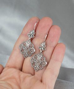 Paisley Earrings Sterling Silver Artisan Handcrafted Art Filigree Style Flower Pattern Dangle Earrings Filigree is made of delicate metal strands that have been skillfully fashioned to create an outstanding combination of old and modern art. Originating in Mesopotamia, Anatolia. It is made of delicate metal strands that have been skillfully fashioned to create an outstanding combination of old and modern art. We feel it is exciting for customers to be a part of the design process for their jewelry, from picking stones to completion. As such, we prefer to include you in the many phases of creating, with our workshop onsite where you can come at any time to be a part of its development. Silver Filigree Dangle Flower Earrings, Bohemian Filigree Earrings For Anniversary, Sterling Silver Filigree Flower Earrings For Gift, Bohemian Sterling Silver Flower Earrings, Gift Sterling Silver Filigree Flower Earrings, Filigree Sterling Silver Chandelier Earrings For Gift, Sterling Silver Filigree Chandelier Earrings As Gift, Sterling Silver Filigree Flower Earrings, Silver Filigree Flower Earrings In Sterling Silver