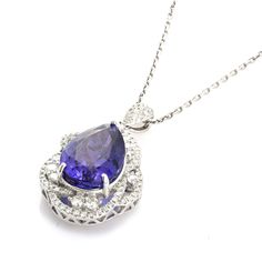 Elevate your style with this exquisite 8.37 Cts Tanzanite and White Diamond Pendant. Crafted in 18K white gold, this timeless piece features a stunning tanzanite gemstone surrounded by sparkling white diamonds. With its classic design and elegant appeal, it is the perfect addition to any jewelry collection. Formal Tanzanite Diamond-cut Jewelry, Luxury Tanzanite Gemstones In White Gold, Classic Tanzanite Pendant Jewelry, Luxury Tanzanite Oval Pendant Necklace, Luxury Tanzanite Pendant Necklace, January Birthstone Jewelry, Yellow Jewelry, April Birthstone Jewelry, Brown Jewelry