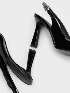 Step into any room with confidence in these patent slingback pumps. The sleek pointed-toed silhouette and high-shine black finish effortlessly exudes sophistication and poise. Perched on elegant 9cm trapeze heels, these shoes will elongate your frame for a flattering leg-lengthening effect - perfect when paired with sharp pantsuits. With adjustable slingback straps for a custom fit, these shoes are your best bet for an instant confidence booster. Confidence Boosters, Charles Keith, Slingback Pump, Black Pumps, Custom Fit, With Confidence, Pumps, Confidence, Sleek