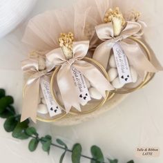 three small candy bags with ribbons tied around them