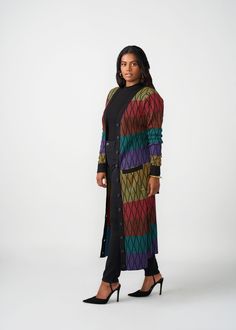 Style#: 7003/P7003 We love versatility and the Aisha African Print Cardigan in Rainbow Diamond Stripes delivers just that. Wear this gorgeous duster-length cardigan sweater open as a layering accent to your outfit of fully buttoned as a statement dress. Features: Contrast color rib knit border and sleeve cuff Can be styled open or closed Regular Length Range: 51-53" Plus Length Range:53 1/2"-54 1/2" Designed in the USA, imported Care Instructions: Hand wash cold. Do not soak. Do not bleach. Lay Multicolor V-neck Outerwear For Layering, Multicolor Long Cardigan For Layering, Long Multicolor Cardigan For Layering, Multicolor V-neck Cardigan One Size, Multicolor Long Cardigan For Spring, Long Multicolor Spring Cardigan, Multicolor Long Outerwear For Layering, Multicolor Long Sweater For Fall, Multicolor Long Cardigan One Size