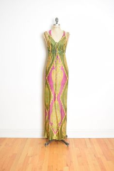 Description: This is an awesome vintage maxi dress from the 70s. It's made of light-weight nylon tricot (lined at the bust only) that's purple and olive green with a paisley print. This dress has an elastic waist and it closes behind the neck with a button. Excellent condition Label: Young Edwardian by Arpeja **Colors in real life may vary a little from the pictures, due to lighting and monitor differences**   Measurements: This dress fits like a size small, but please go by the measurements. Chest: 34" Waist: 28-30" sits high Hips: 37" Underarm to hem: 50" Shoulder to hem: 61" Sleeve length: Shoulder to shoulder: Inseam: Clipped back in photos?: no Size on tag: 11 Vintage 70s Dress, Vintage Dress 70s, Seventies Fashion, High Hips, Vintage Maxi Dress, 70s Dress, Inspo Board, The 70s, Dress Clothes For Women