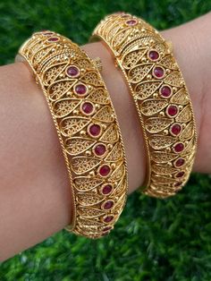 Polki Gold Plated Ruby Kundan Bangle Kada Festive Motif Bangle Bracelets, Traditional Bracelets With Intricate Design, Festive Bangle Bracelet With Motifs, Traditional Intricate Bracelet Jewelry, Adjustable Bangle With Intricate Design For Festive Occasion, Handmade Traditional Bangle Jewelry, Festive Motif Bangle Bracelet, Traditional Bracelet With Intricate Design, Bohemian Round Bracelet For Festive Occasions