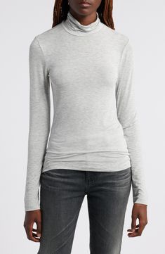 This trim turtleneck is made from sheer and stretchy fabric designed to layer beautifully under all your closet favorites. Turtleneck Long sleeves Sheer 93% modal, 7% spandex Machine wash, dry flat Imported Versatile Long Sleeve Elastane Top, Stretch Modal Long Sleeve Tops, Fitted Long Sleeve Modal Top, Fitted Modal Long Sleeve Tops, Elastane Long Sleeve Top For Layering, Fitted Long Sleeve Top For Layering, Stretch Mock Neck Top With Fine Knit Long Sleeves, Stretch Fine Knit Long Sleeve Mock Neck Top, High Neck Fitted Top For Layering