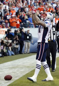 a football player catching a ball on the field