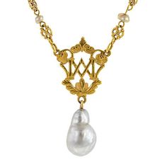 An ornate, openwork plaque with letters, accented by a filigree link chain stationed with fresh water pearls and finished with baroque pearl drop, pendant measures 1 3/4 inches long, fashioned in 18k yellow gold (tested) with 10k yellow gold clasp. Circa 1880. Length 16 inches. Classic Baroque Pearl Drop Necklace, Classic Baroque Pearl Necklace With Pendant, Antique Pearl Pendant Necklace For Formal Occasions, Formal Baroque Pearl Necklace With Pearl Charm, Formal Baroque Pearl Necklace With Charm, Luxury Baroque Pearl Drop Jewelry, Victorian Pearl Drop Necklace, Antique Formal Pearl Chain Necklace, Antique Pearl Chain Jewelry For Formal Occasions