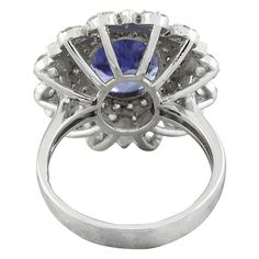 Stamped: 14K Total Ring Weight: 7.1 Grams Tanzanite Weight 6.00 Carat (12.00x9.60 Millimeters)Diamond Weight: 1.00 carat (F-G Color, VS2-SI1 Clarity )Face Measures: 22.55x19.95 Millimeter SKU: [600533] Formal Cluster Sapphire Ring With Vvs Clarity, Formal Vvs Clarity Cluster Sapphire Ring, Marquise Sapphire Ring With Vvs Clarity For Formal Occasions, Formal Marquise Sapphire Ring With Vvs Clarity, Gia Certified Cluster Halo Ring For Formal Occasions, Formal Gia Certified Cluster Halo Ring, Formal Tanzanite Diamond Ring, Oval Shape, Oval Tanzanite Diamond Ring For Formal Occasions, Formal Tanzanite Diamond Ring Oval Shape