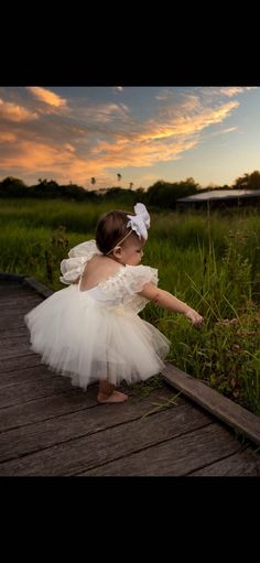 This beautiful ivory tulle dress is perfect for first birthday photoshoots, cake smash session or a flower girl dress. Dress can be custom made in sizes newborn thru 10 years of age.  Bodice top is made of a stetch knit, which is light weight and breathable.   Tulle skirt is made of 100% nylon tulle. MEASUREMENTS ARE AS FOLLOWED: 0-3 months: Waist 18" Length 9" 3-6 months: Waist 18" Length 9" 6-9 months: Waist 19" Length 9" 9-12 months: Waist 19" Length 10" 12-18 months: Waist 19.5" Length 11" 2 Tulle Dress Newborn, Cream Tulle Princess Dress For Baptism, Cream Tulle Tutu Dress For Baptism, White Cute Tutu Dress For First Birthday, Cream Tulle Skirt Tutu Dress For Baptism, Summer Cream Tulle Princess Dress, Cream Princess Dress With Tulle Skirt For Party, White Tulle Fairy Dress For Baptism, Princess Style Tulle Dress In Cream