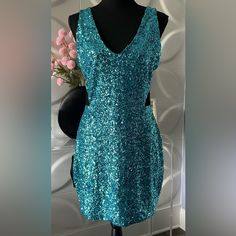 Beautiful, Women's Blue Sequined Party Dress By Bebe In A Size Large Nwt. This Sexy Dress Features A Sleeveless Design With V-Neck And All Over Blue Sequins With Black Mesh Side Vents. Fully Lined. Fabric Is Nylon And Spandex. Measurements When Flat: 19 Inches From Armpit To Armpit. 33 Inches In Length From Top Of Shoulder To Bottom Of Dress. 16 Inches For Waist. 19 Inches For Hips. In Excellent Condition; New With Tag. Tags: Women's Dress, Bebe, Bebe Dress, Sequined Dress, Party Dress, Cocktail Sleeveless Mini Dress For Evening Parties, Sleeveless Mini Dress For Night Out, Blue Backless Sleeveless Dress For Party, Sleeveless Mini Dress For Prom Night Out, Sleeveless Sequin Dress For Prom Season Date Night, Blue Sleeveless Party Dress, Glamorous Sleeveless Holiday Party Dress, Flirty Sleeveless Sequin Dress For Holiday, Blue Sleeveless Dress For Party Season