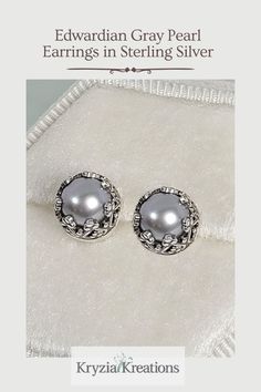 These vintage style gray pearl stud earrings radiate a bit of romantic mystery with their dove gray color and the intricate settings.   See and shop these Edwardian Gray Pearl Stud Earrings at www.KryziaKreationsStudio.com Exquisite Silver Pearl Earrings For Anniversary, Antique Silver Pearl Earrings For Anniversary, Ornate Silver Pearl Earrings For Formal Occasions, Victorian Silver Pearl Earrings For Anniversary, Silver Victorian Pearl Earrings For Anniversary, Vintage Silver Pearl Earrings For Formal Occasions, Elegant Gray Round Jewelry, Elegant Round Gray Jewelry, Victorian Silver Pearl Drop Earrings