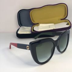 Gucci Cat Eye Sunglasses Gg0164s Black This Is An Authentic Pair Of Gucci Cat Eye Sunglasses Gg 0164/S In Black. These Sunglasses Are Black And Have Large Rims With Lenses In Gradient Gray. The Arms Feature A Brass Interlocking Gg Logo At The Temple And A Bee At The End With Color Block Temples Of Black And Green On One Side And Black And Red On The Other. Size Width: 5.75 In Height: 2.25 In Length: 5.75 In Designer Cat Eye Tinted Sunglasses, Luxury Multicolor Sunglasses With Tinted Lenses, Luxury Multicolor Tinted Sunglasses, Gucci Cat Eye Sunglasses With Tinted Lenses, Designer Gucci Cat Eye Sunglasses, Designer Gucci Cat Eye Sunglasses With Mirrored Lenses, Gucci Designer Cat Eye Sunglasses With Mirrored Lenses, Gucci Cat-eye Sunglasses With Tinted Lenses, Gucci Cat Eye Polarized Sunglasses