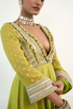 Introducing the asteria anarkali, crafted from a blend of georgette and chanderi silk in a refreshing lime green hue. This ensemble exudes timeless elegance with its flowing silhouette and intricate detailing, promising to make a statement at any event. Elevate your style with the epitome of grace and sophistication. Rishi Vibhuti, Infographic Illustrations, Simple Anarkali, Georgette Suits, Shoot Moodboard, Clothes Details, Simple Kurtis, Green Anarkali, Indian Suit