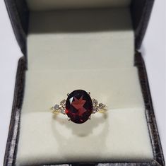 14k solid yellow gold natural garnet semi precious gemstone and natural round brilliant cut shaped diamonds gemstones ring. 1. The weight of the natural garnet gemstone used in the ring =3.10 cts. 2. The weight of the natural diamonds gemstones used in the ring =0.18 cts. 3. The weight of the 14k solid yellow gold used in the ring =2.534 grms. The garnet is the birthstone for the people born in the month of January. The ring is absolutely stunning and gorgeous. I have used all my skills and expe Formal Gold Diamond Ring With Garnet, Formal Garnet Gemstone Diamond Ring, Gold Garnet Jewelry With Diamond Accents, Formal Garnet Birthstone Ring In Fine Jewelry Style, Formal Garnet Birthstone Ring Fine Jewelry, Formal Garnet Birthstone Ring, Formal Garnet Rings With Gemstone Accents, Formal Garnet Diamond Ring With Accent Stones, Oval Ruby Ring With Gemstone Accents In Yellow Gold