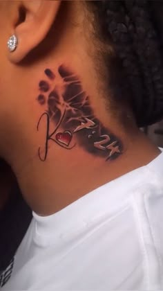 a woman with a tattoo on her neck