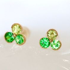 Sapphire Trio Stud Earrings in 14Kt YELLOW  Garnet Minimal Trio Studs Push Back Earrings Green Stud Measurement: 5.5mm*5.5mm - 6* 2.7mm Natural Round Brilliant Cut Neon Green Tsavorite Garnet - Measurement: 5.5mm*5.5mm - 14k Yellow Gold Push back style with Silicone Backing - All Stones are Ethically Sourced - Natural Stones May Slightly Vary in Color 7-day return accepted. This item will be sent in well-made velvet jewelry box Please feel free to browse my shop for additional pieces of certifie Yellow Gold Tsavorite Earrings As Gift, Tsavorite Yellow Gold Earrings For Gift, Yellow Gold Tsavorite Earrings Fine Jewelry, Hypoallergenic 14k Gold Green Jewelry, Hypoallergenic Green 14k Gold Jewelry, Gold Tsavorite Earrings Fine Jewelry, Yellow Gold Tsavorite Gemstone Earrings, Gold Tsavorite Gemstone Earrings, 14k Gold Green Earrings