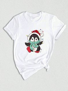 Get ready to celebrate the holiday season in style with our Penguin Christmas Shirt! This adorable shirt features a cute penguin design that will instantly put you in a festive mood. Whether you're attending a Christmas party or just spreading some holiday cheer, this shirt is a must-have addition to your wardrobe. So why wait? Grab your Penguin Christmas Shirt today and get ready to sleigh the holiday fashion game!Penguin Christmas Shirt, Funny Penguin Shirt, Penguin Lover Shirt, Cute Penguin Shirt, Penguin Clothes, Penguin Lover Gift White Casual  Short Sleeve  Animal,Cartoon,Christmas,Colorblock,Figure,Geometric,Graphic,Letter,Striped,Plants,Textured Pattern    Women Clothing, size features are:Bust: ,Length: ,Sleeve Length: Holiday Crew Neck T-shirt With Character Print, Holiday T-shirt With Character Print And Crew Neck, Cute Short Sleeve T-shirt For Winter, White Christmas Tops With Cartoon Print, White Christmas Cartoon Print Tops, Holiday Cotton Tops With Character Print, White Tops With Cartoon Print For Christmas, Holiday Cotton Top With Character Print, White Cartoon Print Tops For Christmas