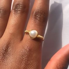 This simple gold, dainty, faux pearl ring is handmade out of wire, this ring is sturdy but can be bent, so a lot of force should not be applied to this! You only get 1 ring per purchase. I also sell matching pearl earrings, a simple pearl necklace and bridal pearl necklaces, these are all perfect to wear throughout the summer.  SIZING: - US 4 --- UK H--- Pandora size 46 --- 14.60mm (diameter) - US 4 1/2 --- UK H1/2 - I1/2 --- Pandora size 48 --- 15.30mm  - US 5 --- UK J-K --- Pandora size 50 --- Adjustable Dainty Toe Ring Jewelry, Dainty Adjustable Toe Ring Jewelry, Minimalist Adjustable Pearl Rings, Dainty Stackable Pearl Promise Ring, Adjustable Minimalist Pearl Ring, Delicate Toe Ring Jewelry, Dainty Gold Plated Toe Ring Jewelry, Delicate Tiny Toe Ring Jewelry, Wire Wrapped Round Pearl Jewelry