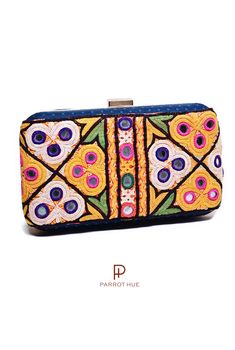 You'll look boho-chic with this Blueberry clutch. A classy and artistic handcrafted clutch. The Kutch Embroidery is a handicraft and textile signature art tradition of the tribal community of Kutch District in Gujarat. The embroidery with mirror work on this piece is unique and varies from piece to piece. It takes several days to hand embroider each piece. So, you are not purchasing a bag but a piece of art. This look is elevated to a whole new level by a breathtaking embroidery design. You can Rectangular Multicolor Clutch With Handwork, Multicolor Rectangular Clutch With Handwork, Festive Multicolor Rectangular Clutch, Festive Multicolor Embroidered Handwork Clutch, Bohemian Multicolor Rectangular Clutch, Festive Handmade Multicolor Clutch, Traditional Clutch Bag With Mirror Work, Bohemian Clutch With Handwork As A Gift, Traditional Clutch With Mirror Work