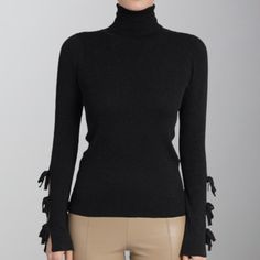 Experience the ultimate comfort and style with our Love Token Sage Sweater in classic black. This chic piece features a cozy turtle neck and feminine bow detailing on the sleeves, adding a touch of elegance to any outfit. Embrace the love and warmth in this must-have sweater! Elegant Solid Winter Turtleneck, Elegant Solid Turtleneck For Winter, Elegant High Neck Turtleneck For Fall, Elegant Stretch Sweater For Fall, Elegant Black Turtleneck For Fall, Elegant Fitted Fall Turtleneck, Elegant Black Fitted Sweater, Fall Tops With Bow Detail, Elegant Stretch Black Sweater