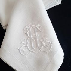 the monogrammed napkins have been embroidered onto each other's linens