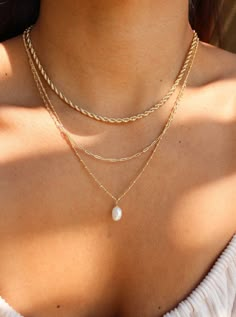 A must-have for any beach lover looking for that perfect dainty piece. The blend of fresh water pearls and gold-filled settings creates the perfect summery beach vibe. Plus, the necklace's non-tarnish material ensures a long-lasting shine! • Single Chain (of Choice) with Pearl Charm• Gold Filled• Pearl Charm Shapes can vary (sizes are between 6-7mm)• Twist Chain Length: 16" + 1" extender• Twist Chain Length: 18" + 1" extender• Bead Chain Length: 20" Gold Pearl Necklaces, Diamond Circle Necklace, Fresh Water Pearl Necklace, Water Pearl Necklace, Casual Necklaces, Pretty Jewelry Necklaces, Gold Pearl Necklace, Summer Bracelets, Gold Necklace Set