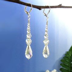 "These dramatic yet elegant icicle earrings feature faceted clear glass crystal beads enclosed within Silver Plated beads and Rondelles.  A larger glass Teardrop crystal finishes the point at the bottom with a tiny silver bead.  They would be lovely for a wedding or any evening event, brightening up that favorite black dress, especially if paired with the matching necklace shown in the last picture and listed here: https://www.etsy.com/listing/1294818573 The teardrop crystals measure 12mm in dia White Gift Boxes, Silver Filigree, Matching Necklaces, Faceted Bead, Wedding Earrings, Crystal Glass, Silver Beads, Crystal Beads, My Jewellery