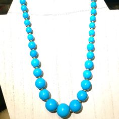 Bold Solid Sky Blue Magnesite Turquoise, No Matrix Solid Sky Blue Graduated Round Beads. Vibrant And Classy Elegant Blue Beaded Necklace For Beach, Turquoise Jewelry With Round Wooden Beads, Elegant Blue Turquoise Necklace With Polished Beads, Elegant Blue Jewelry With Wooden Beads, Blue Polished Beads Beach Jewelry, Turquoise Necklaces With Round Wooden Beads, Turquoise Necklace With Large Round Beads, Blue Polished Beads Jewelry For Beach, Turquoise Necklace With Round Wooden Beads